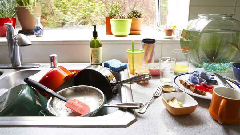 Sink filled with dirty dishes