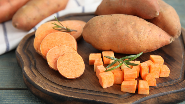 sweet potatoes on a cutting board