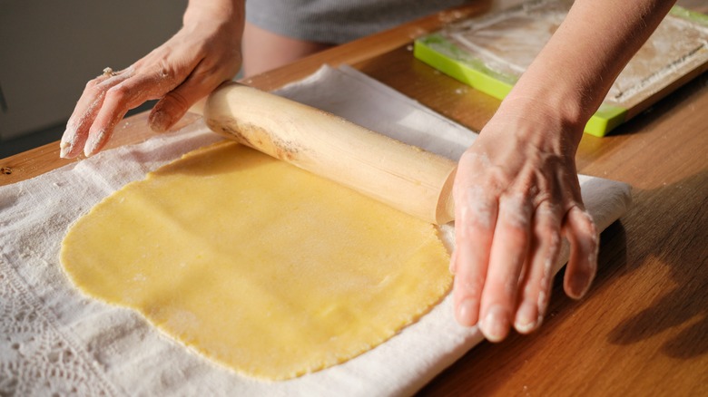 Rolling pie dough with pin