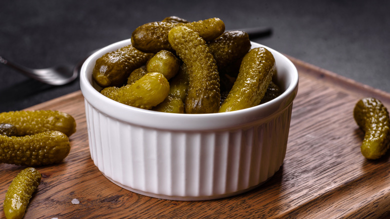 Miniature pickles in a ramekin