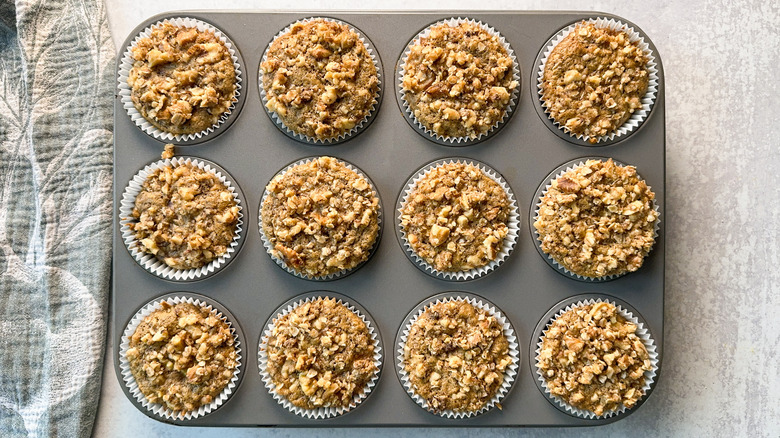 Rhubarb and cardamom oat muffins cooling in pan