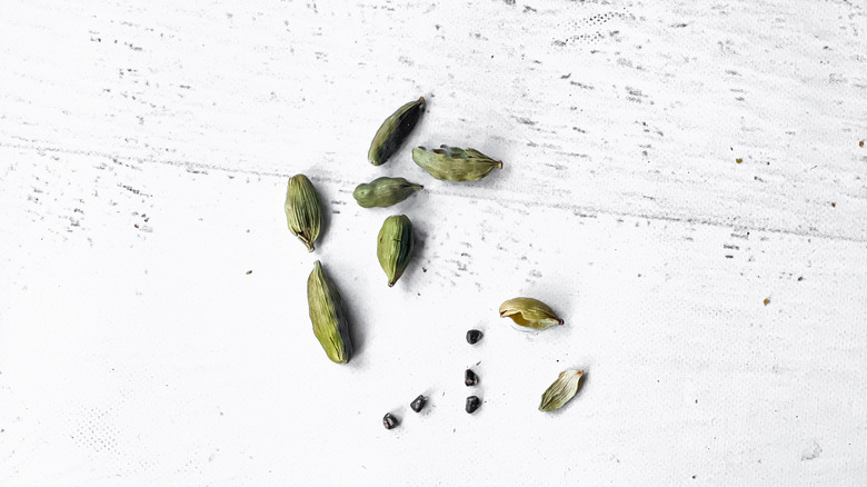 Cardamom pods  and seeds on countertop