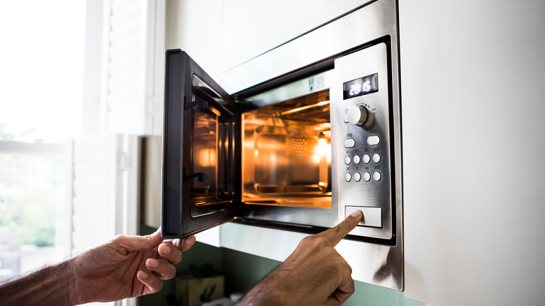 Man using microwave