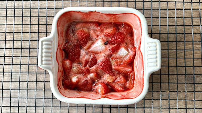 cooked strawberries in white baking pan