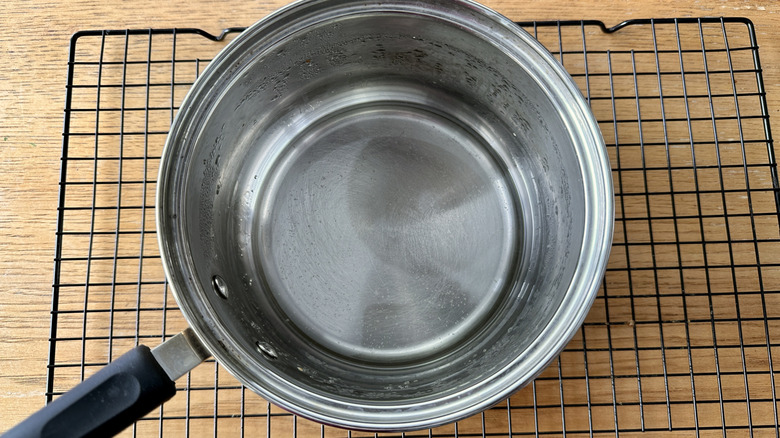 clear liquid in metal pot