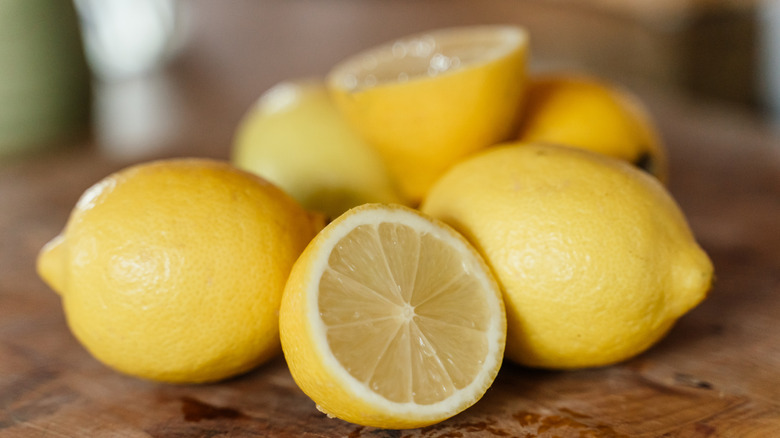 A bunch of lemons on a counter