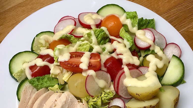 English garden salad, chicken, and potatoes with salad cream