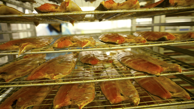 Salmon filets on a smoker rack