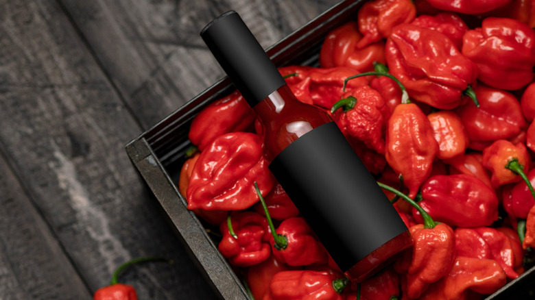 jar of picante on top of red peppers