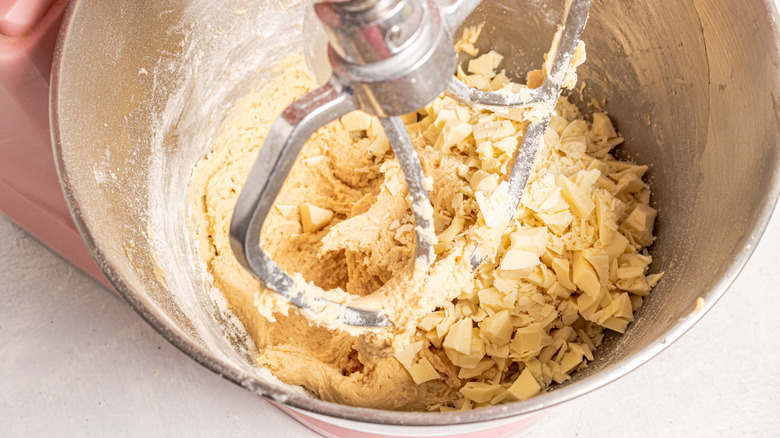 Chopped white chocolate added to cookie batter