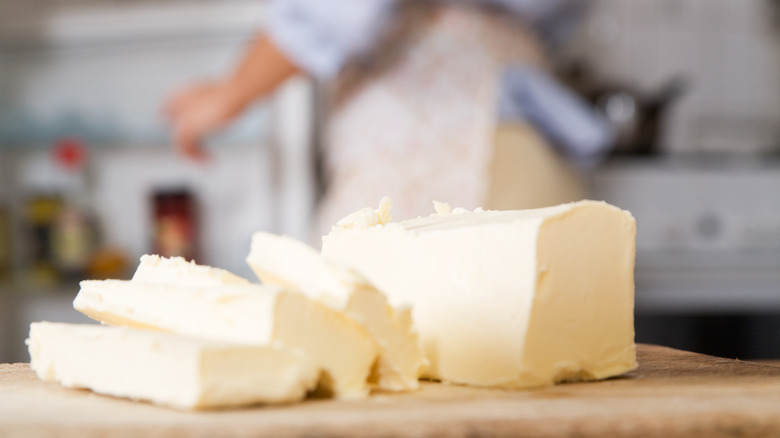 up close of butter with a person in the background