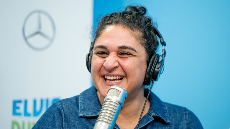 Samin Nosrat speaking into a microphone