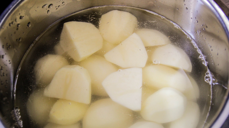 Pot of peeled potatoes