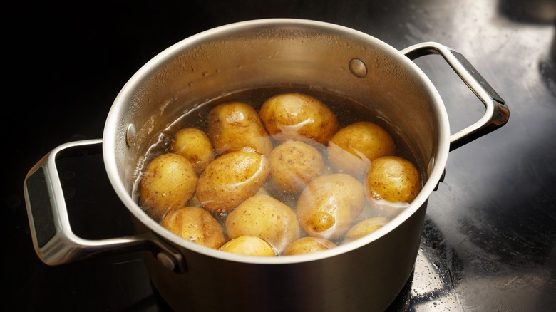 Potatoes in a water pot