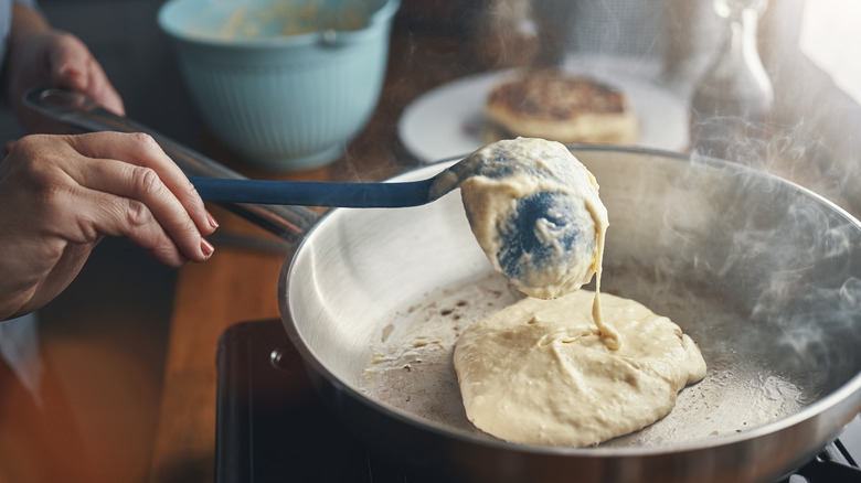 Preparing pancakes in a pan