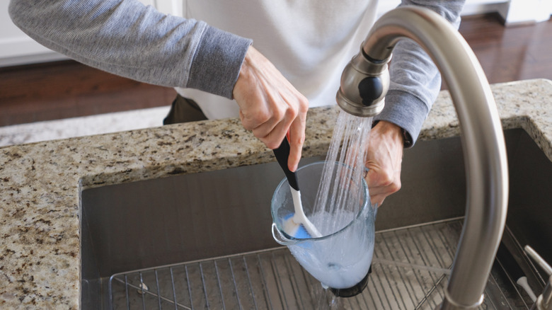 Person washing a blender