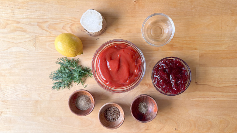 Scandinavian-inspired lingonberry cocktail sauce ingredients on cutting board