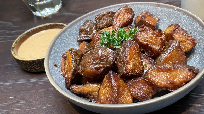 roast potatoes on a blue plate