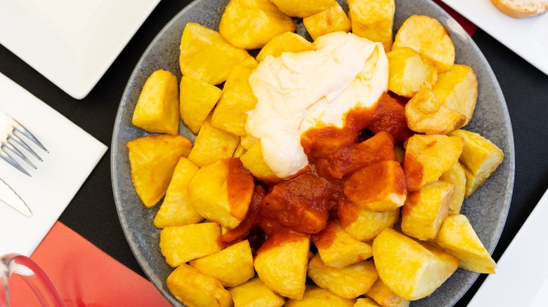 Patatas bravas with aioli and salsa