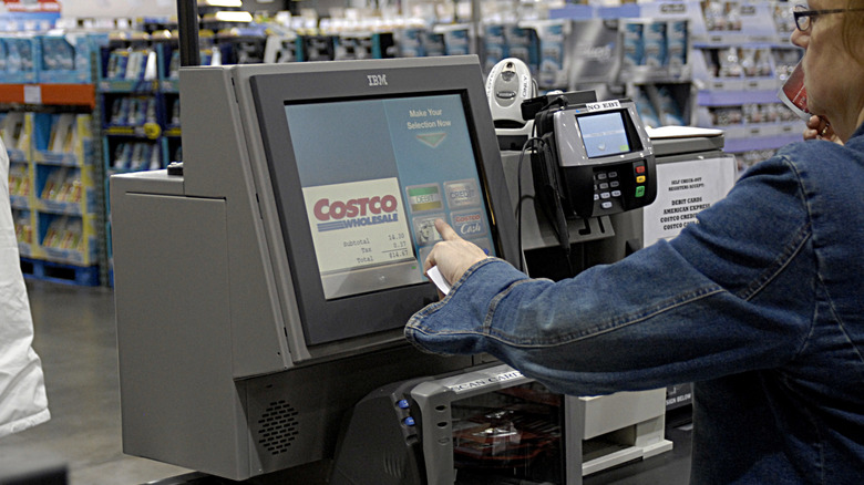 Costco register with membership card