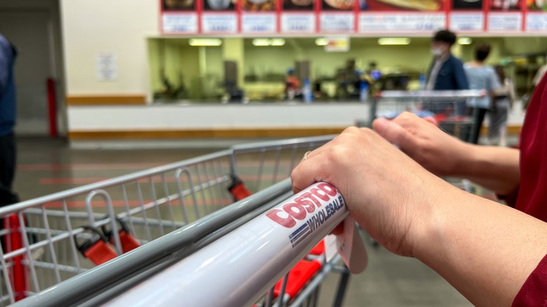 Woman pushing Costco cart