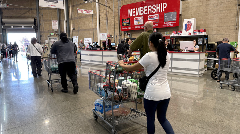 Costco shoppers near membership counter