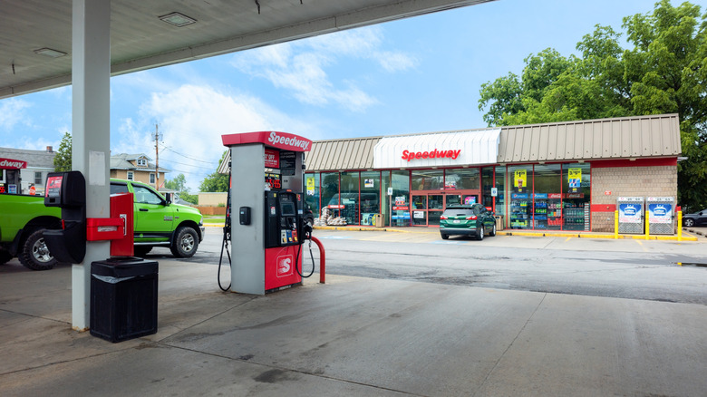 The exterior of a Speedway store with a gas pump in front