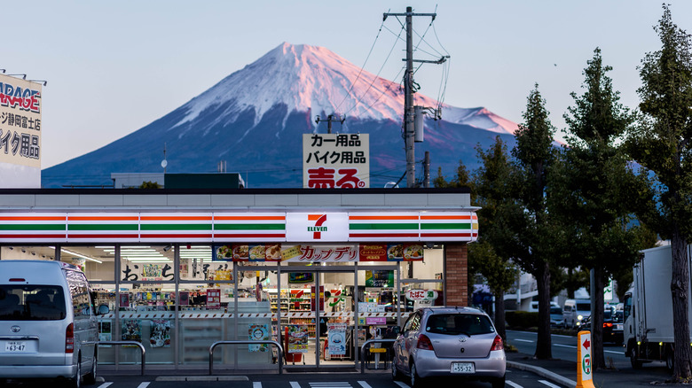 The exterior of a 7-Eleven store with Mt. Fuji in the background