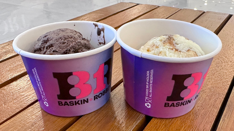 Two cups of Baskin-Robbins ice cream on a table