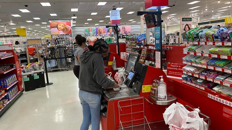 people using a self-checkout lane in Target