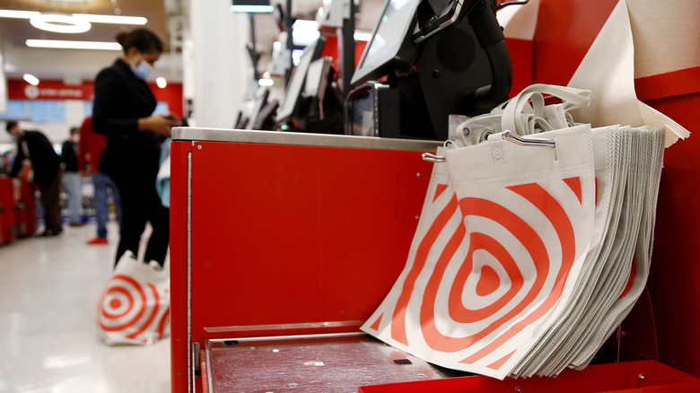 reusable Target bags piled up at a self checkout lane