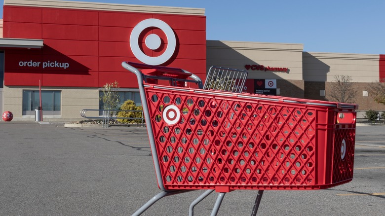 Target shopping cart in front of Target store in an empty lot