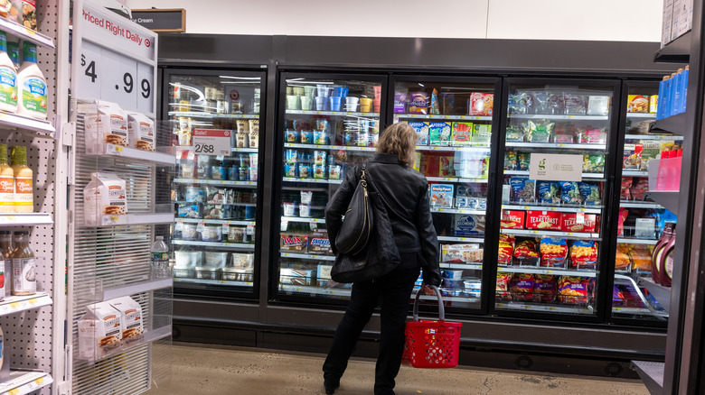 woman shops at Target store in the refrigerated section