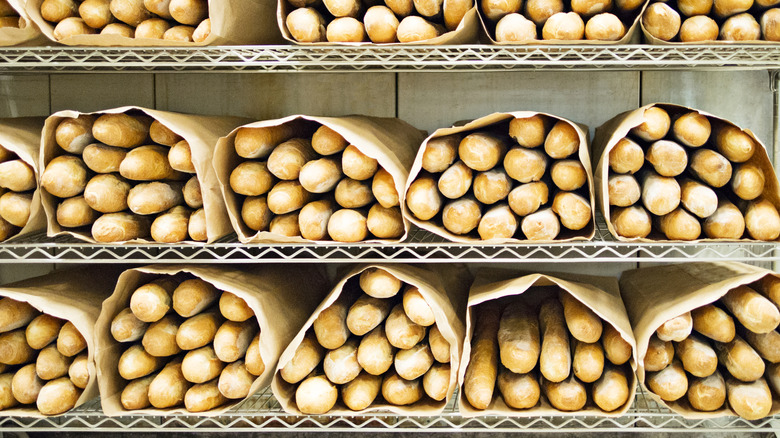 large paper bags of bread on shelves