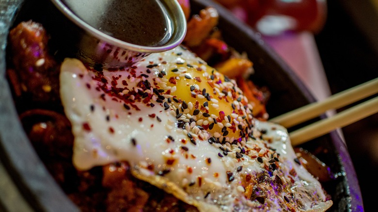 Fried eggs topped with sesame seeds