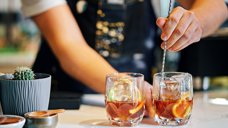 Bartender stirring a cocktail 