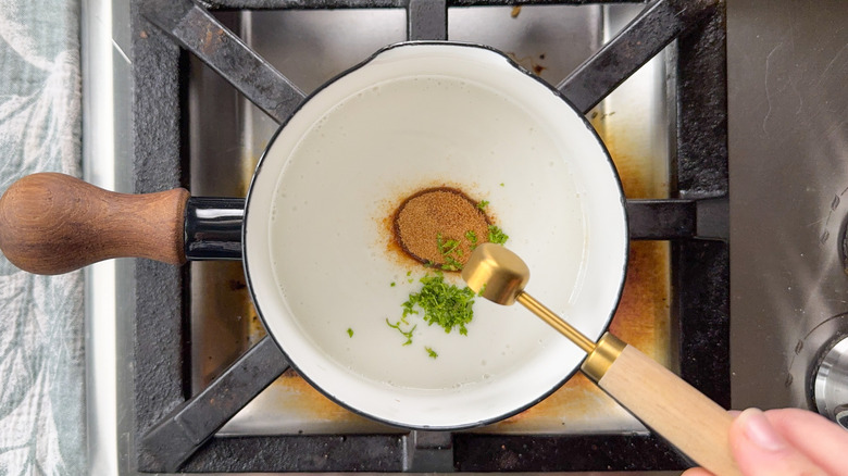 Coconut milk, coconut sugar, and lime zest in small saucepan on stovetop