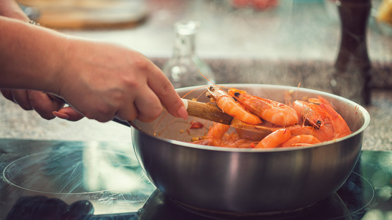 Cooking a pan of shrimp