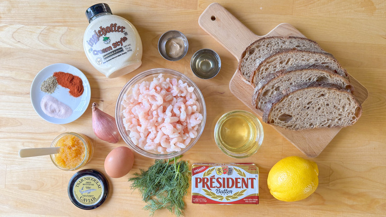 Shrimp salad toast Skagen ingredients on cutting board