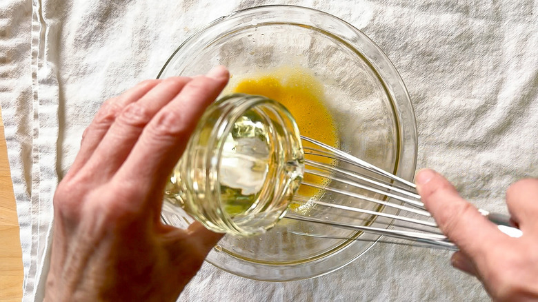 Whisking oil into mayonnaise