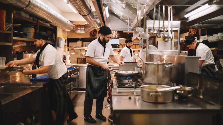 Restaurant kitchen with staff working