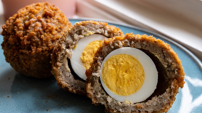 Scotch eggs on plate