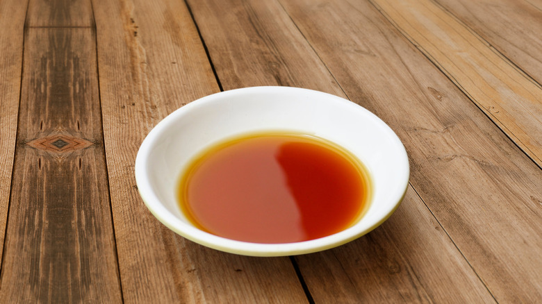 A white bowl of fish sauce