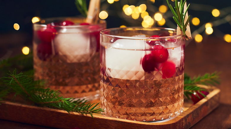 Cranberry ginger ale in glasses with berry garnish