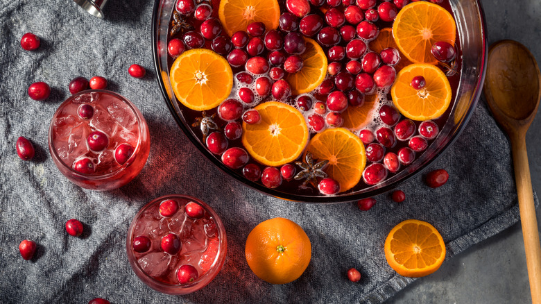 Cranberry ginger ale punch bowl with orange slices