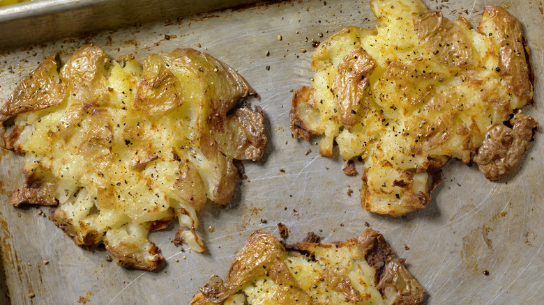 Smashed potatoes on tray