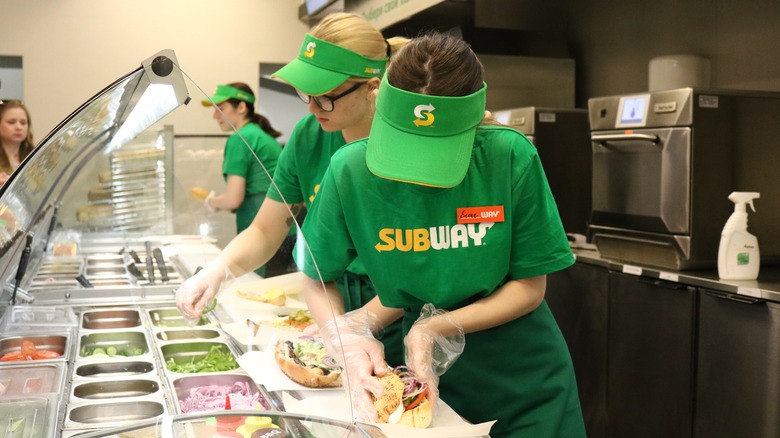 Subway Workers Assembling Sandwiches