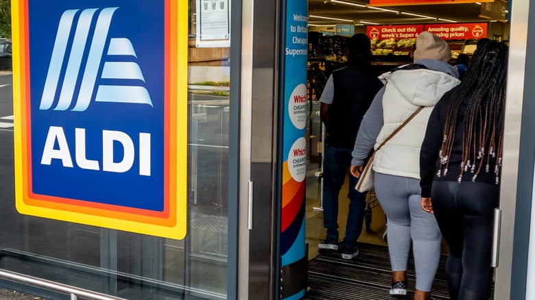 Customers entering an Aldi storefront