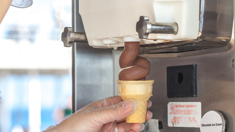 soft serve ice cream dispensed into cone 