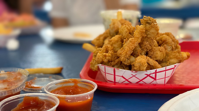 Basket of fried clams with ketchup